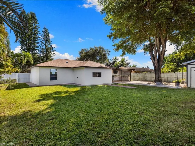 a view of a yard with a house and garden