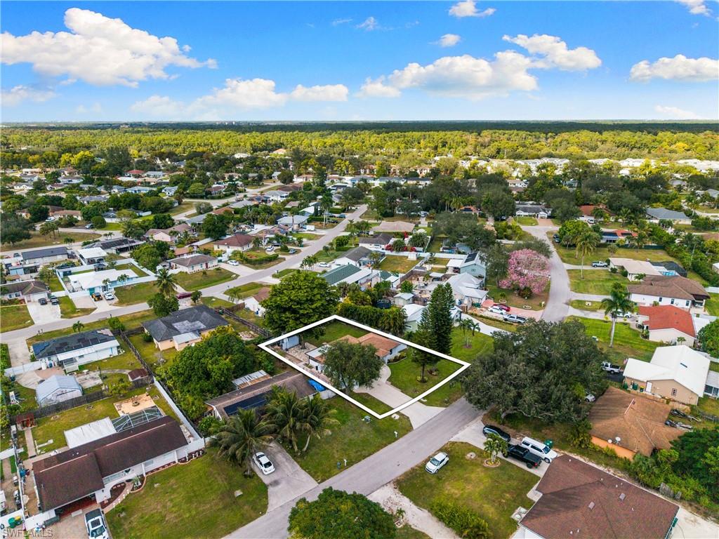 1837 51st Terrace Southwest Naples, FL 34116 - Photo 30 of 35 Aerial overview of property's location with nearby suburban area and property parcel outlined
