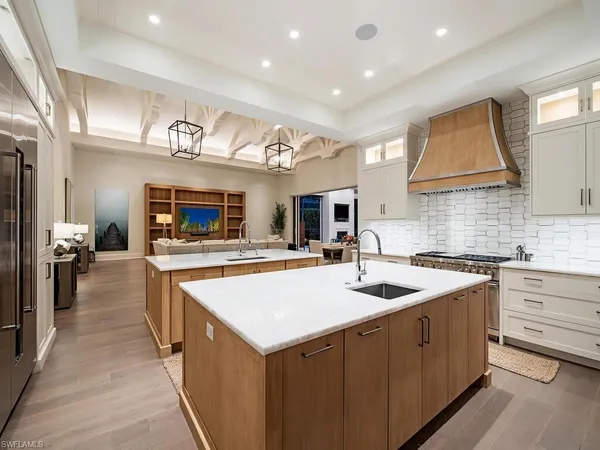a kitchen with stainless steel appliances granite countertop a sink and cabinets