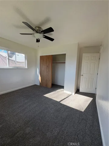 a view of an empty room and a window