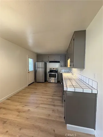 a view of a kitchen with a sink