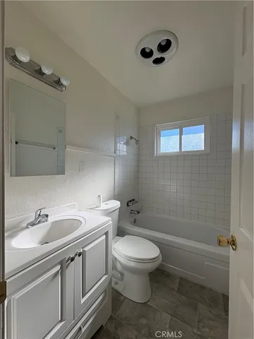 a bathroom with a sink toilet and vanity