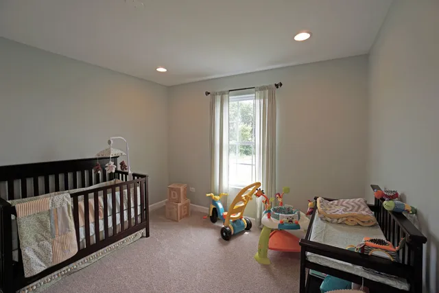 a bedroom with furniture and a window