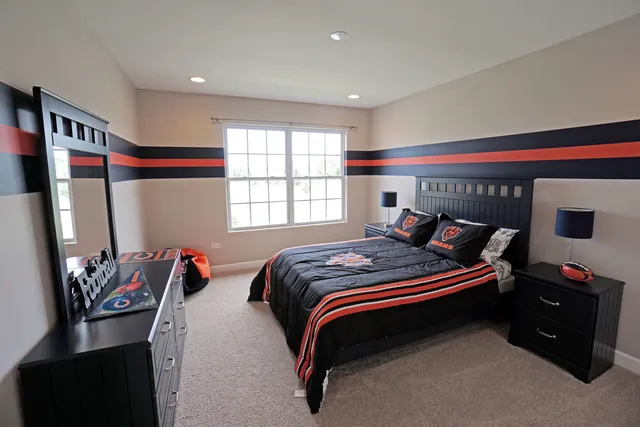 a bedroom with bed and a window