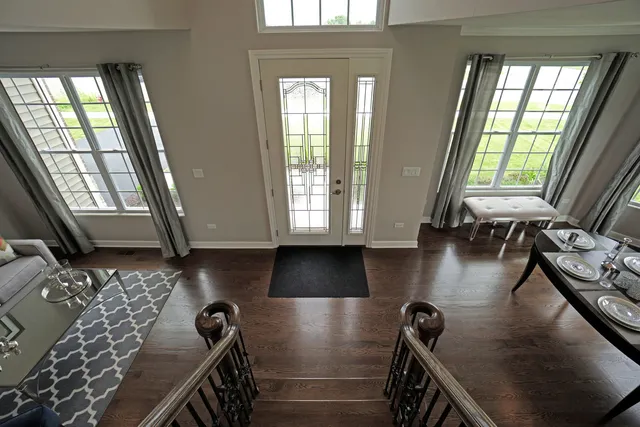 a view of a livingroom with furniture and staircase