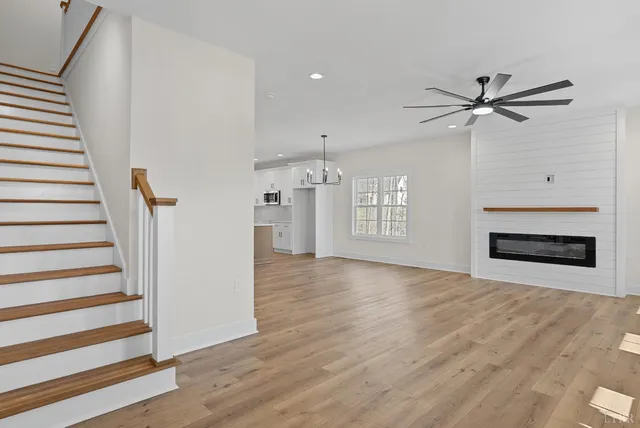 wooden floor in an empty room with a fireplace