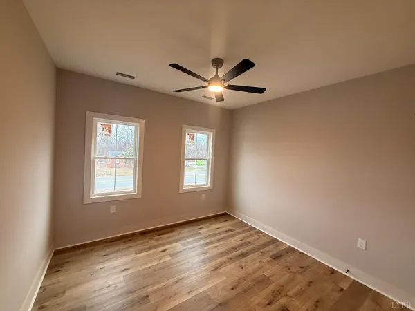 an empty room with fan