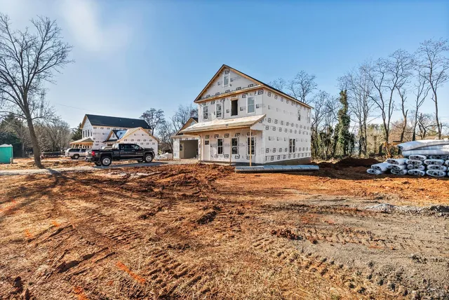 a view of a house with large windows