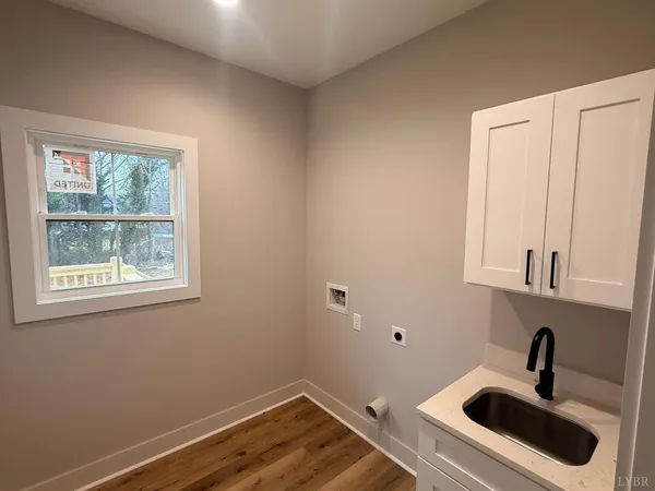 a bathroom with a sink and a window