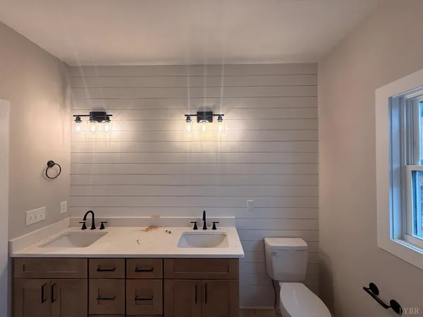 a bathroom with a shower and a sink