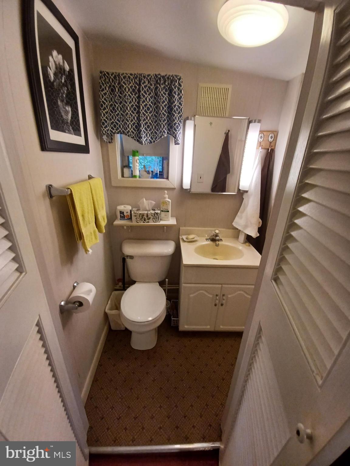 2 Park Monroeville, NJ 08343 - Photo 12 of 19 a bathroom with a toilet sink and mirror