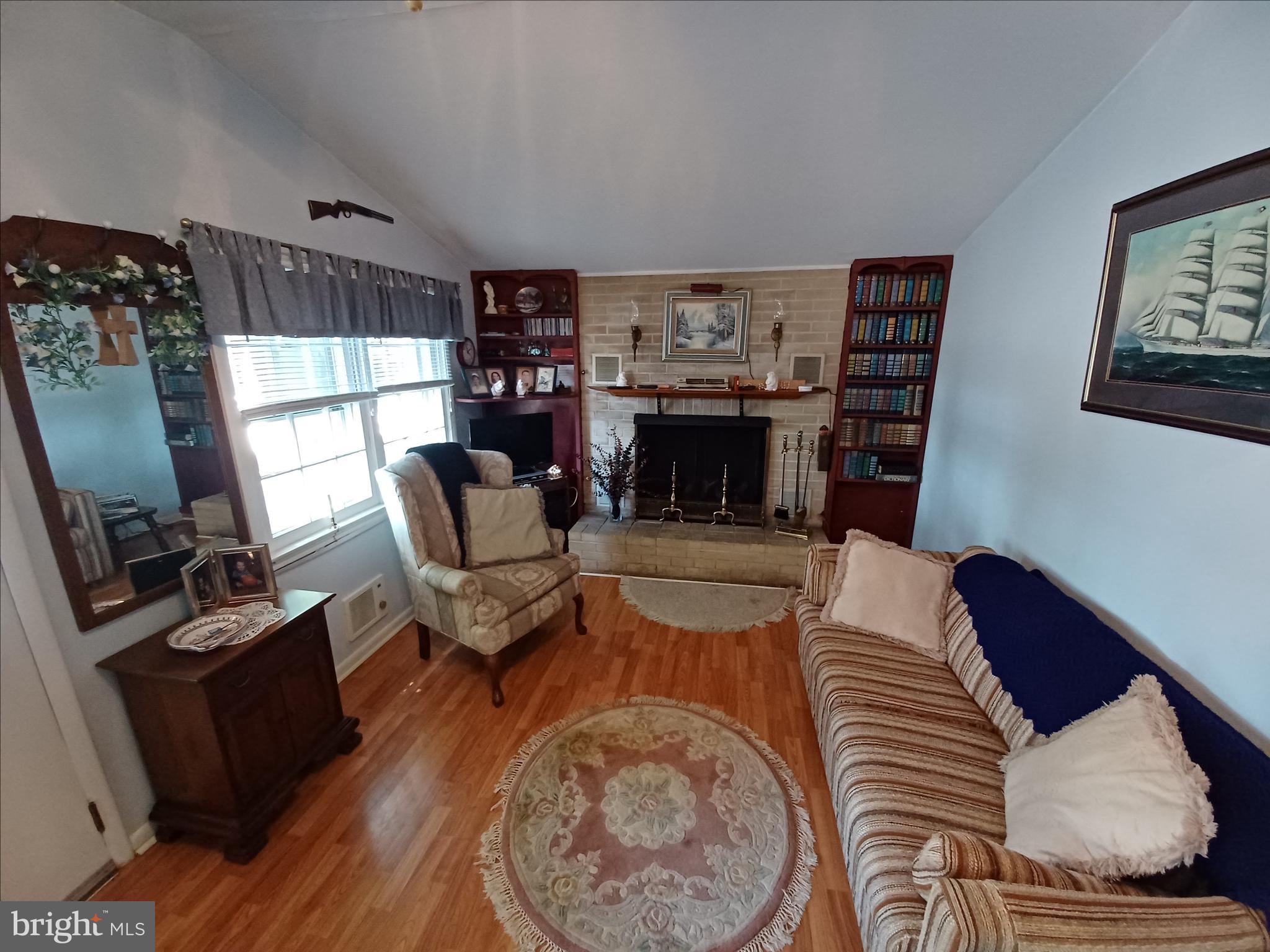 2 Park Monroeville, NJ 08343 - Photo 4 of 19 a living room with furniture and a fireplace