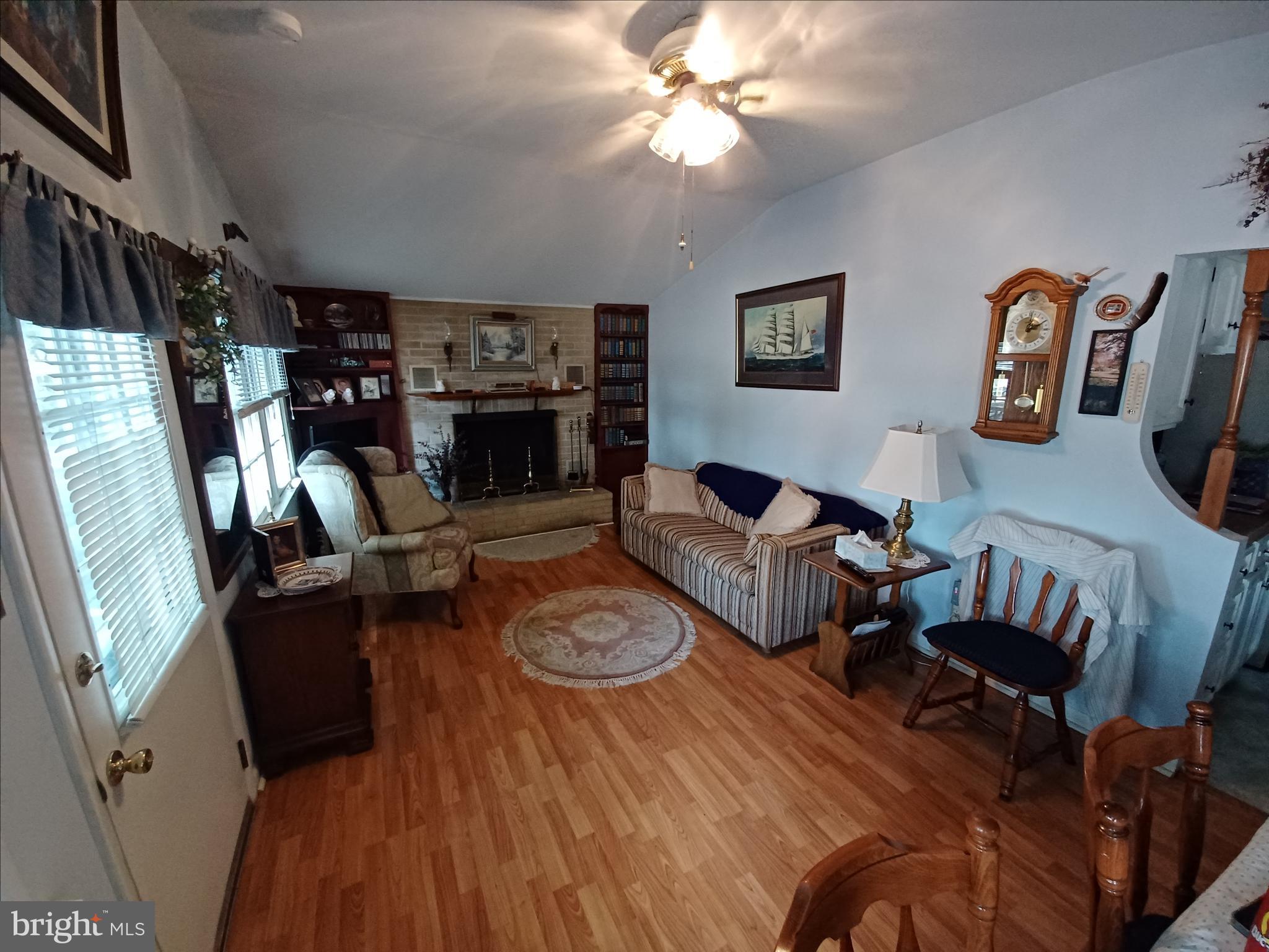 2 Park Monroeville, NJ 08343 - Photo 5 of 19 a living room with furniture a fireplace and a flat screen tv