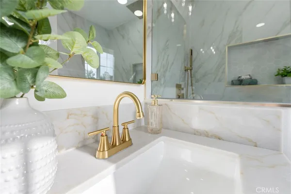 a bath tub sitting next to a bathroom sink