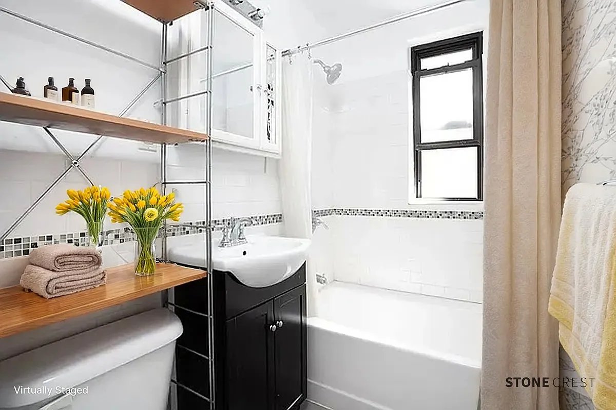 55 West 92nd Street, Unit 3C Manhattan, NY 10025 - Photo 3 of 7 a bathroom with a sink and a mirror