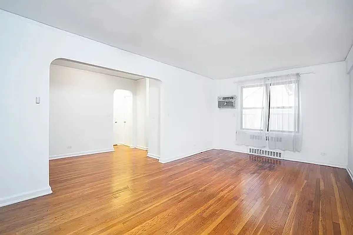 55 West 92nd Street, Unit 3C Manhattan, NY 10025 - Photo 5 of 7 an empty room with wooden floor and windows