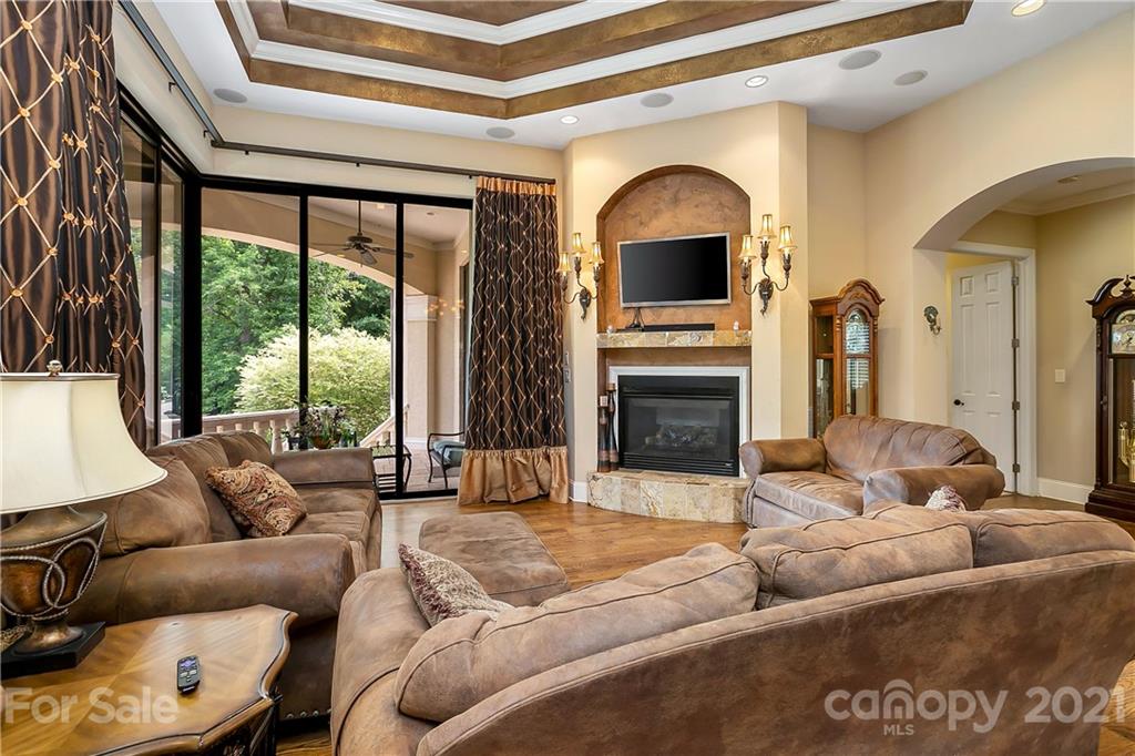 8891 Graham Point Lane Denver, NC 28037 - Photo 11 of 37 a living room with furniture fireplace and flat screen tv
