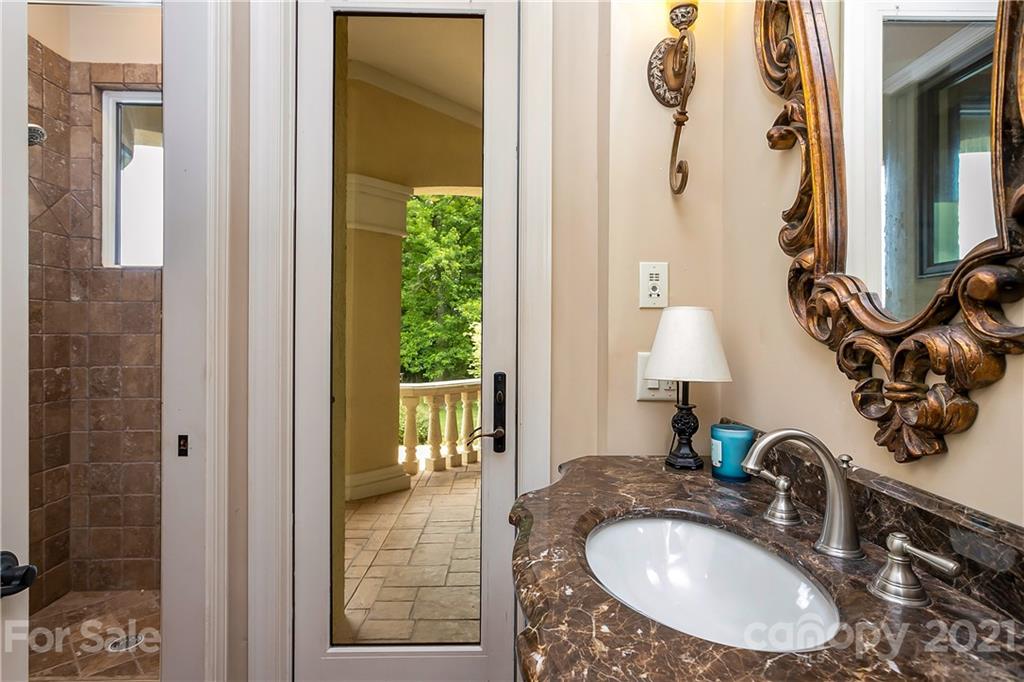 8891 Graham Point Lane Denver, NC 28037 - Photo 12 of 37 a bathroom with a sink and a mirror