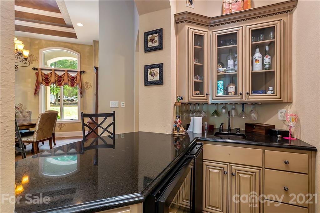 8891 Graham Point Lane Denver, NC 28037 - Photo 13 of 37 a kitchen with a table chairs and cabinets