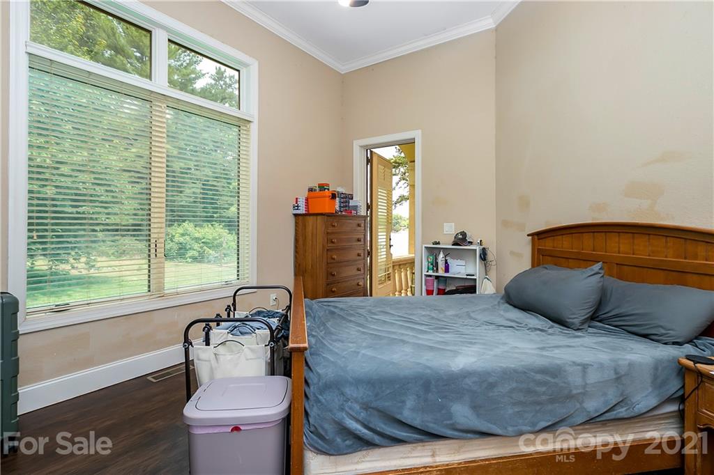 8891 Graham Point Lane Denver, NC 28037 - Photo 17 of 37 a bedroom with a bed and a window