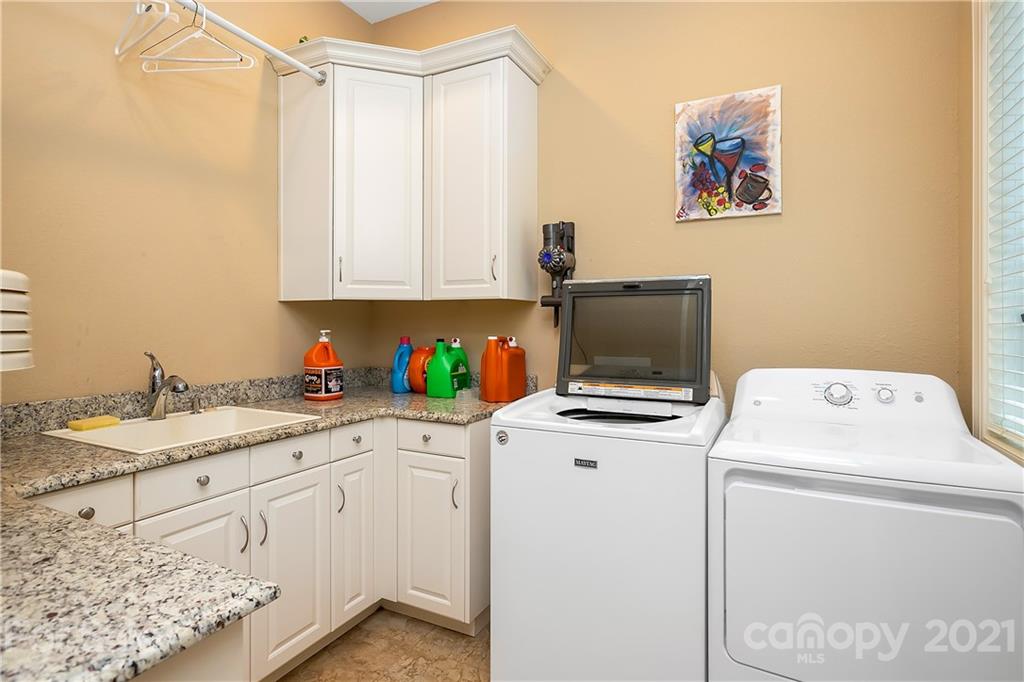 8891 Graham Point Lane Denver, NC 28037 - Photo 19 of 37 a room with storage and utility