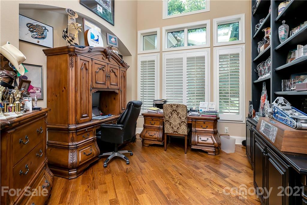 8891 Graham Point Lane Denver, NC 28037 - Photo 20 of 37 a view of a workspace with furniture and a fireplace