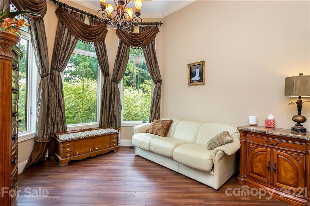 8891 Graham Point Lane Denver, NC 28037 - Photo 26 of 37 a living room with furniture and a large window