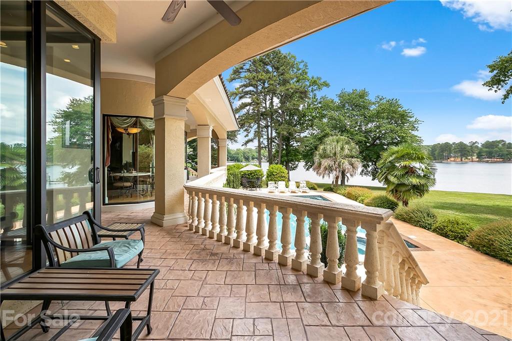 8891 Graham Point Lane Denver, NC 28037 - Photo 28 of 37 a view of a chairs and table in patio next to a yard