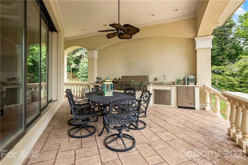 8891 Graham Point Lane Denver, NC 28037 - Photo 29 of 37 a view of a dining tables and chairs in the balcony