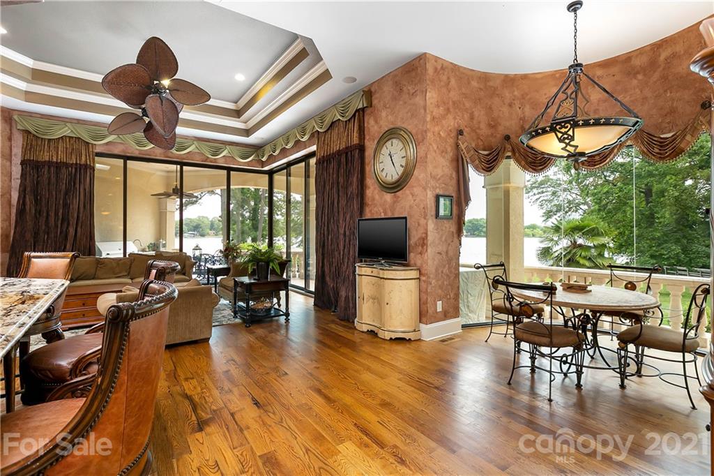 8891 Graham Point Lane Denver, NC 28037 - Photo 4 of 37 a view of a dining room with furniture window and wooden floor