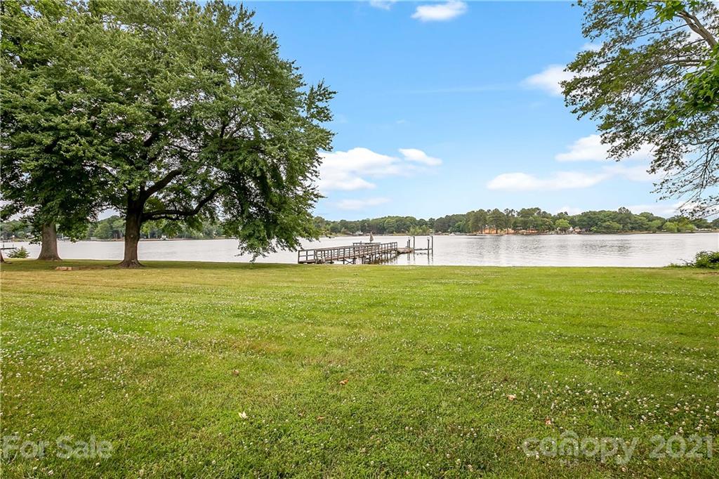 8891 Graham Point Lane Denver, NC 28037 - Photo 31 of 37 a view of yard with lake and houses in the back