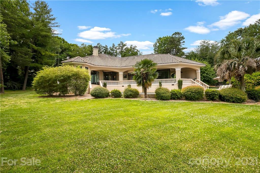 8891 Graham Point Lane Denver, NC 28037 - Photo 32 of 37 a front view of a house with garden