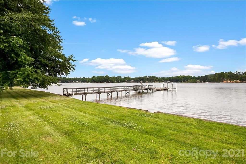8891 Graham Point Lane Denver, NC 28037 - Photo 33 of 37 a view of a lake with houses in the back