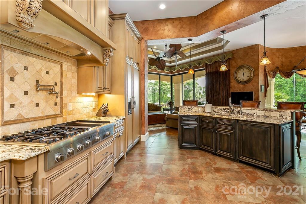 8891 Graham Point Lane Denver, NC 28037 - Photo 8 of 37 a large kitchen with stainless steel appliances granite countertop a stove and a sink