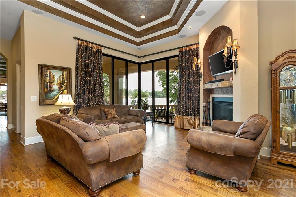 8891 Graham Point Lane Denver, NC 28037 - Photo 10 of 37 a living room with furniture fireplace and flat screen tv