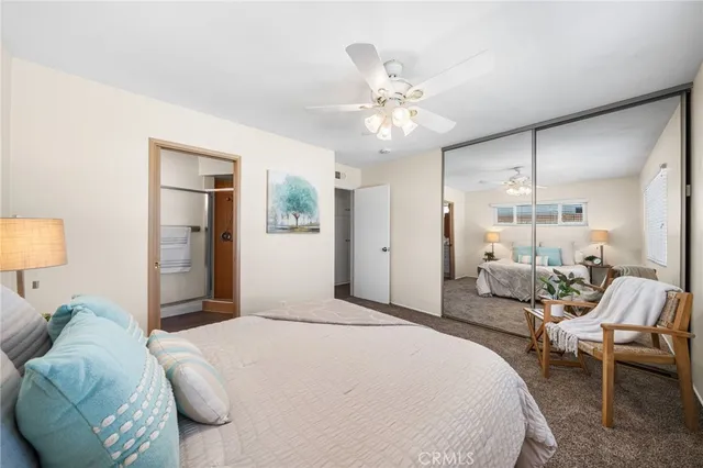 a bedroom with a bed and a chair