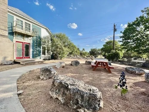 a view of a backyard with sitting area