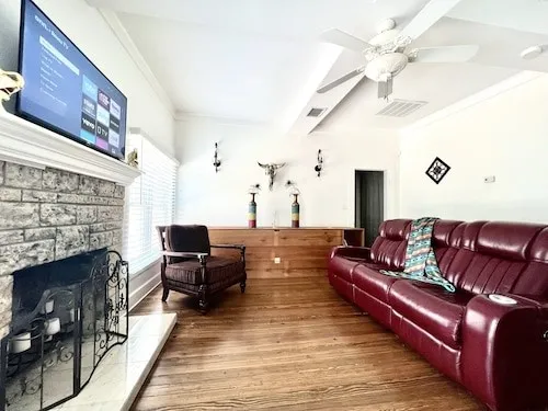 a living room with furniture and a fireplace