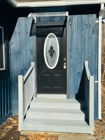 a view of entryway with wooden floor