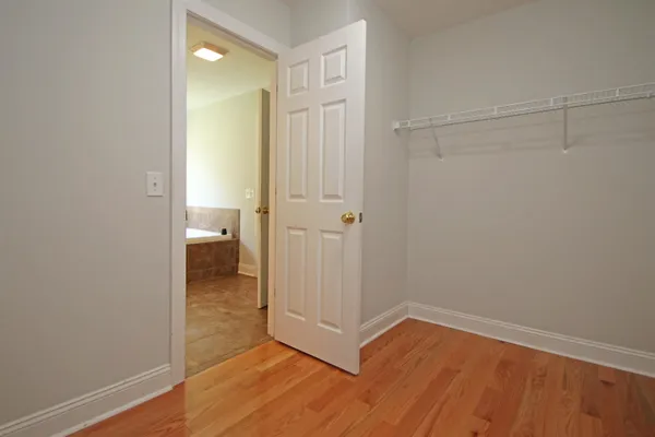 a view of a bathroom with wooden floor