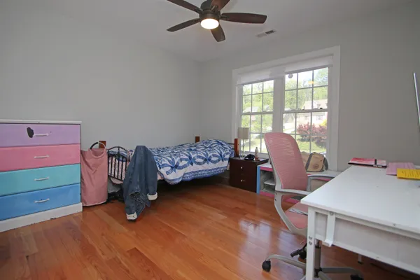 a bedroom with furniture and a window