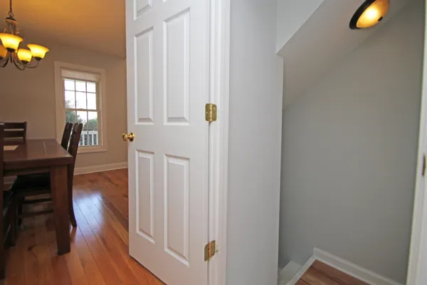 a view of a livingroom with wooden floor and windows