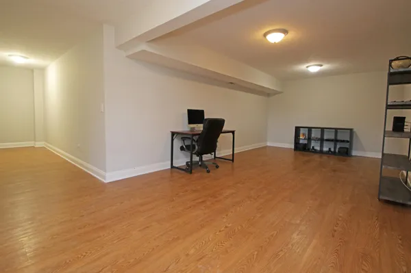 a view of room with furniture and a ceiling fan
