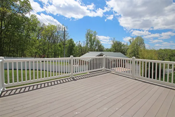 a view of a balcony with wooden fence