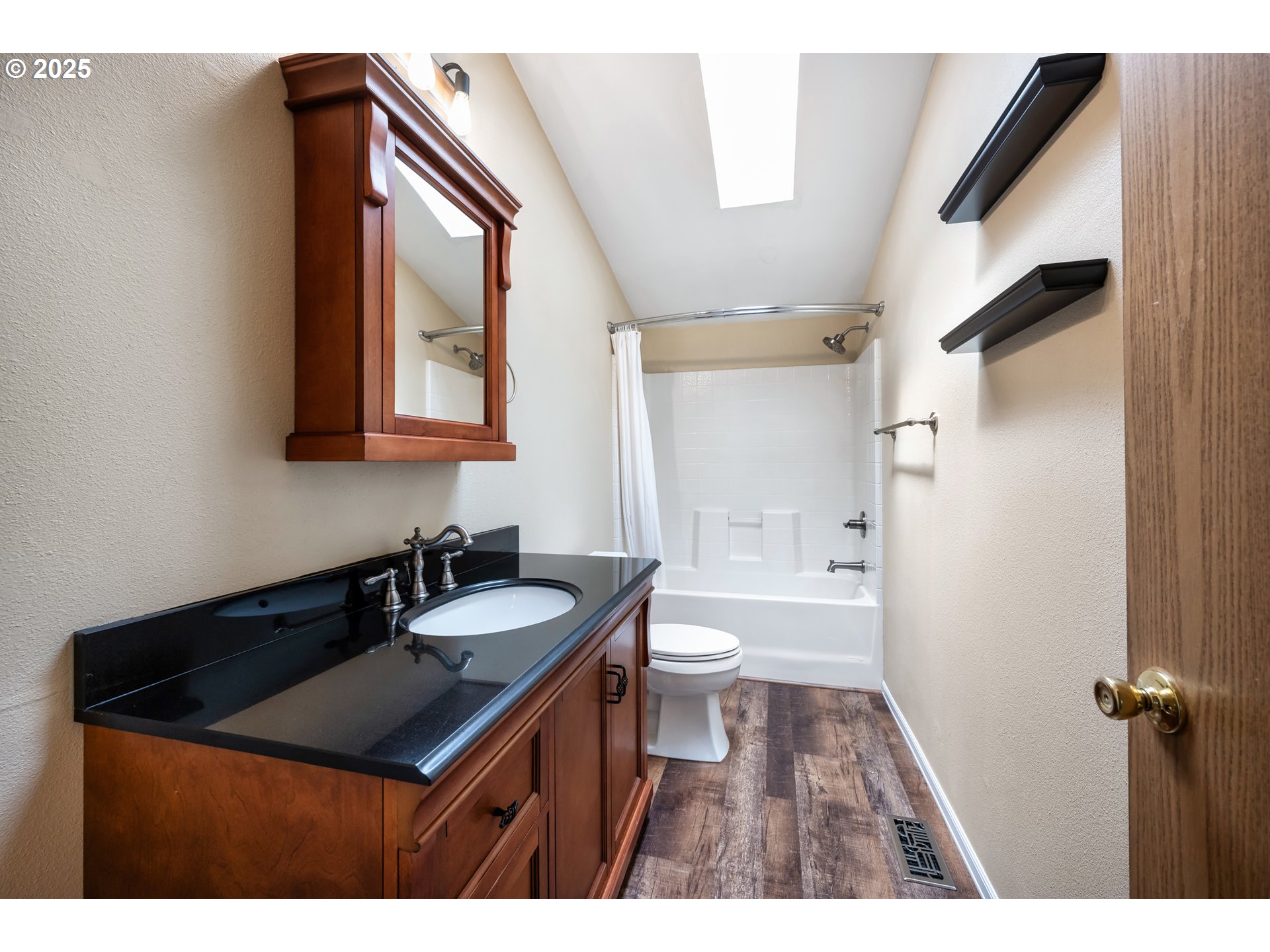 16173 North Drive La Pine, OR 97739 - Photo 22 of 23 a bathroom with a sink a toilet and a mirror