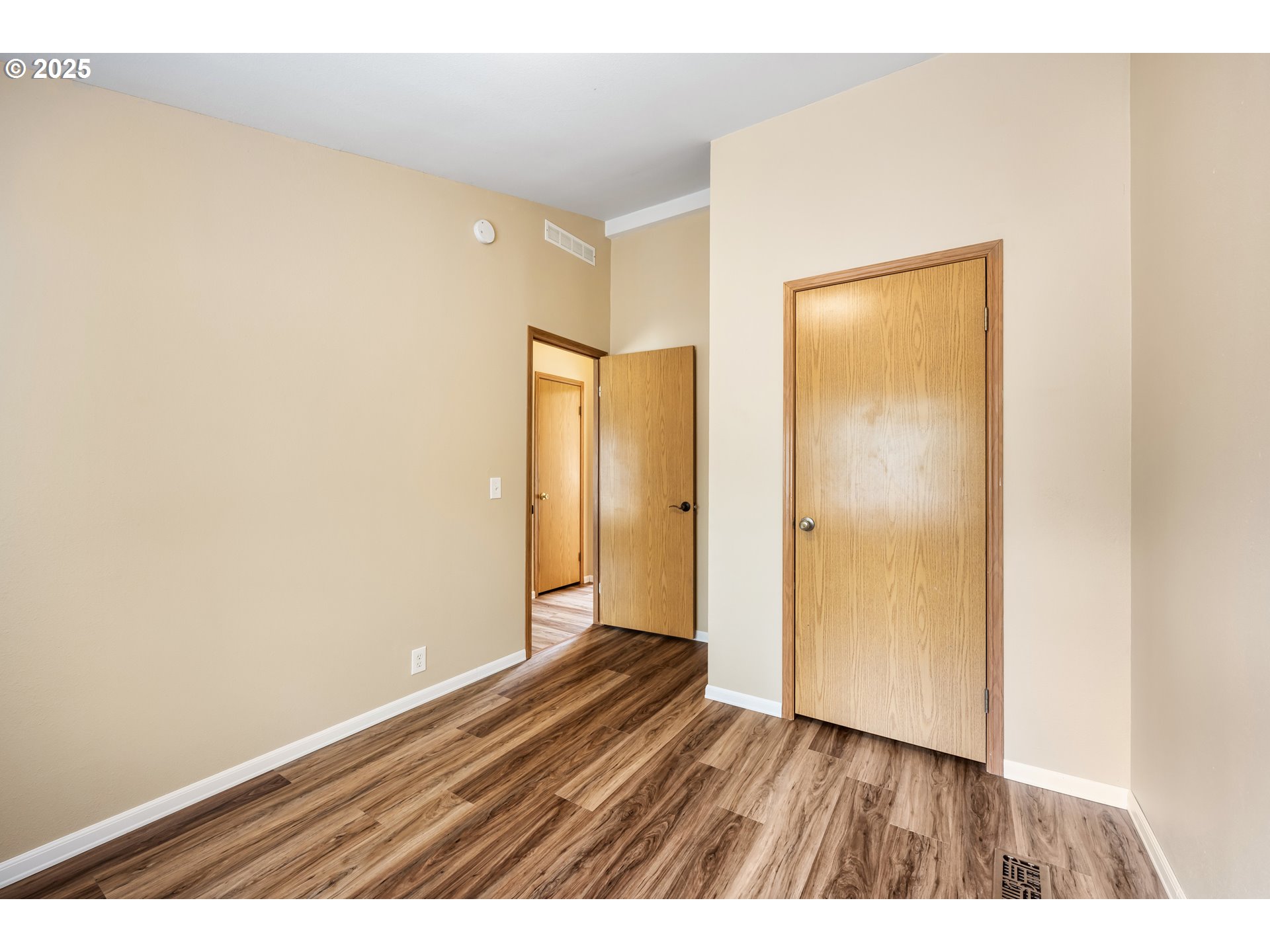 16173 North Drive La Pine, OR 97739 - Photo 10 of 23 a view of an empty room with wooden floor