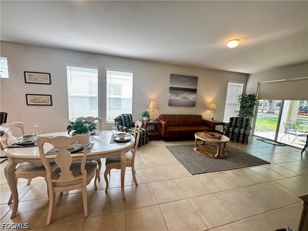 882 Friendship Circle LaBelle, FL 33935 - Photo 17 of 37 a living room with furniture a wooden floor and a window