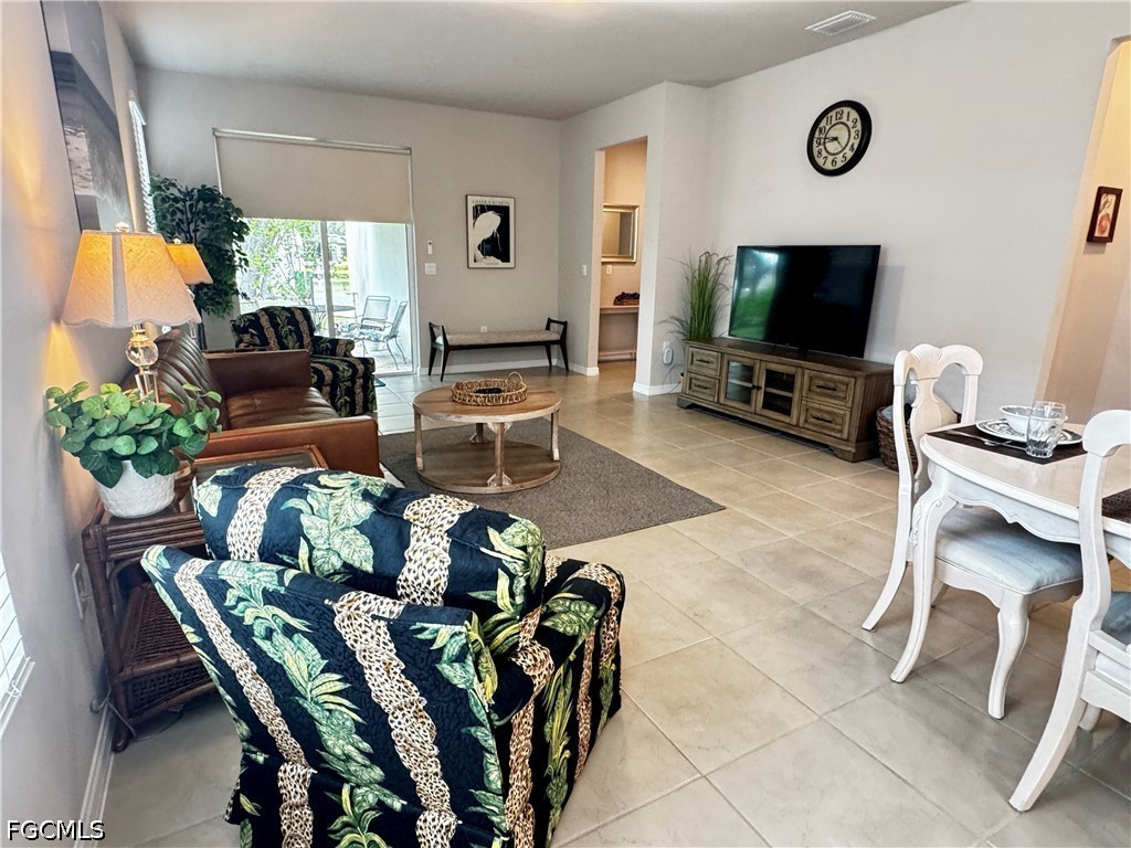 882 Friendship Circle LaBelle, FL 33935 - Photo 19 of 37 a living room with furniture and a flat screen tv