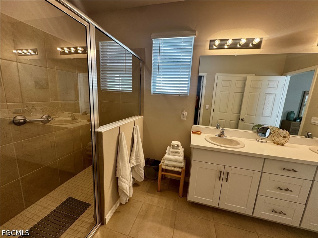 882 Friendship Circle LaBelle, FL 33935 - Photo 24 of 37 a bathroom with a double vanity sink a toilet and a mirror