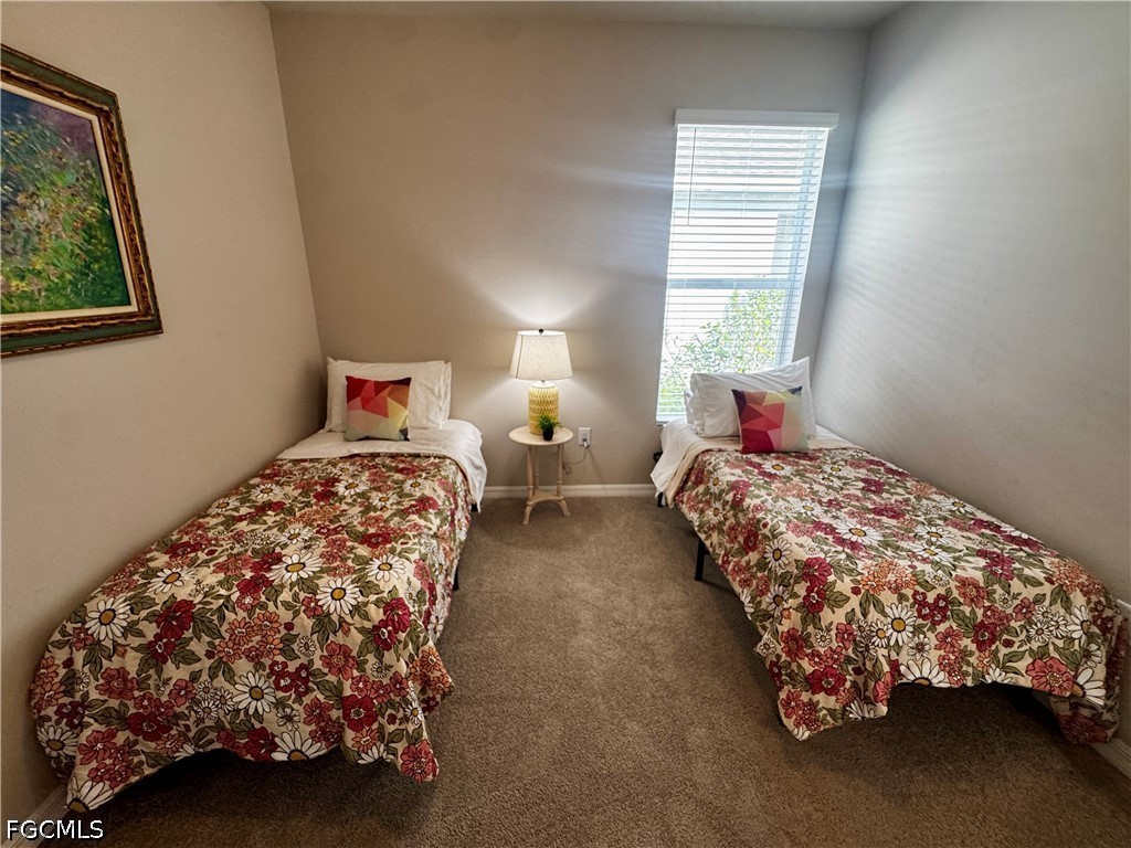 882 Friendship Circle LaBelle, FL 33935 - Photo 27 of 37 a bedroom with bed and a window